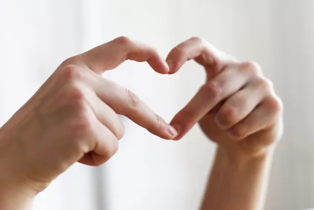 A person looks uncertain while receiving comforting words from a friend, reflecting on doubt in friendships.