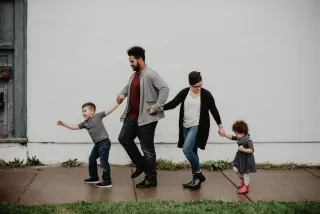 A step-parent and biological parent discussing roles amid tension in a blended family