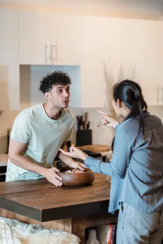 Person reflecting on uncertainty in a relationship connected to i get defensive when my partner disagrees with me
