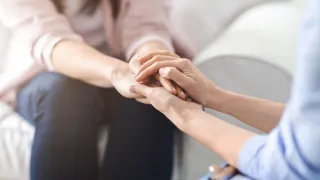 Individual feeling vulnerable yet disconnected during a deep conversation about emotions