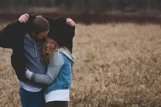 A couple sharing an intimate moment, highlighting emotions when men express love first in relationships