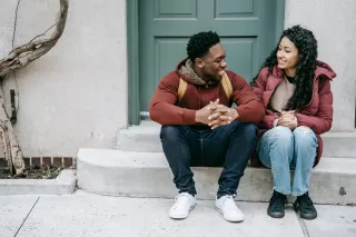 Individual hesitating to engage with new friends after experiencing trauma