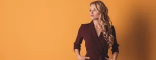 Person confronting rudeness in a social setting, reflecting on what to do about rude people
