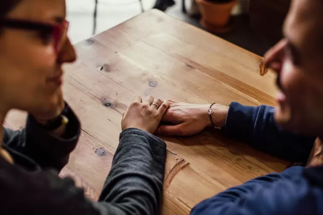 Couple engaging in an open conversation during a year-end relationship check-in