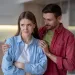 Couple sitting apart, reflecting signs of disconnection and unfulfillment in their relationship
