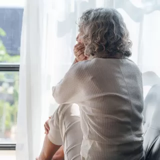 Individual contemplating feelings of shame after estranging a toxic family member