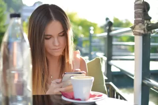 Couple texting each other, one feeling distant and confused about communication