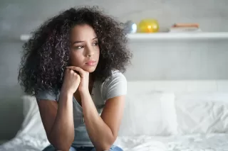 A couple experiencing emotional disconnect after moments of intimacy, illustrating relationship signals.