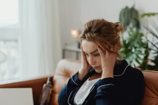 Person feeling overwhelmed while engaging in a tough conversation about feelings