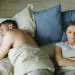 Couple discussing their past relationships, revealing insecurities about sexual histories
