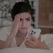 Individual contemplating communication strategies after being ghosted in a relationship