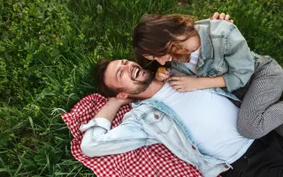 Couple enjoying a peaceful moment in nature, feeling secure in their relationship