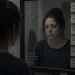 Person shielding emotions while reflecting on trust issues from childhood with narcissistic parents
