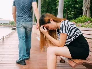 Couple navigating emotional stages while discussing forgiveness in their relationship