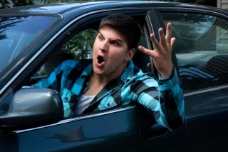 Individual contemplating reactions to rude people during a social interaction