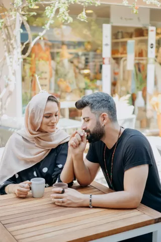 Couple engaging in deep conversation, highlighting bids for connection in their behavior.