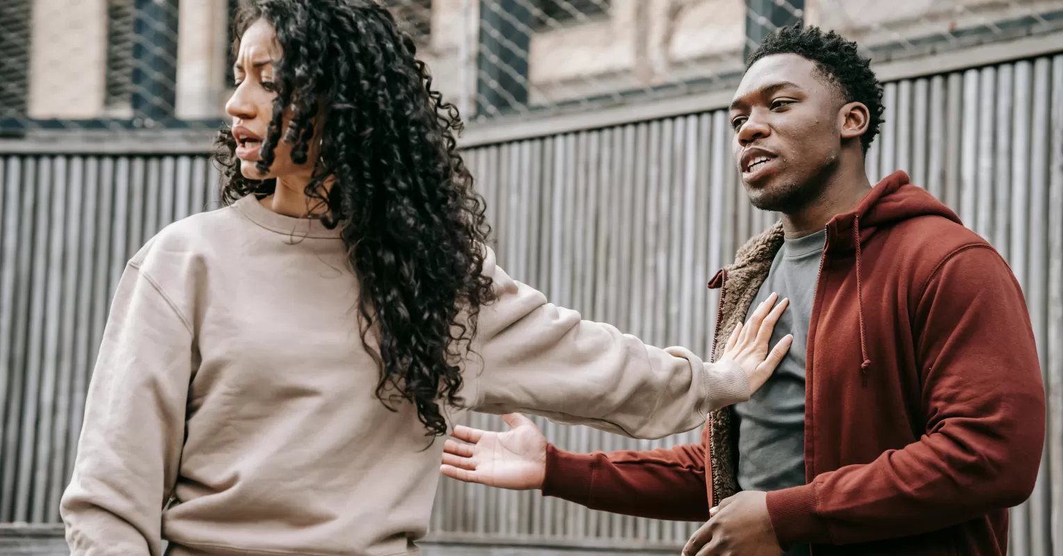 Couple experiencing emotional disconnect, highlighting signs of one partner overwhelmed and shutting down