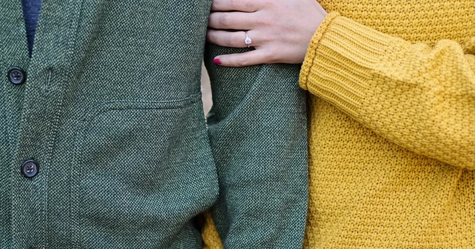 Couple sitting apart, reflecting on the signs they're falling out of love