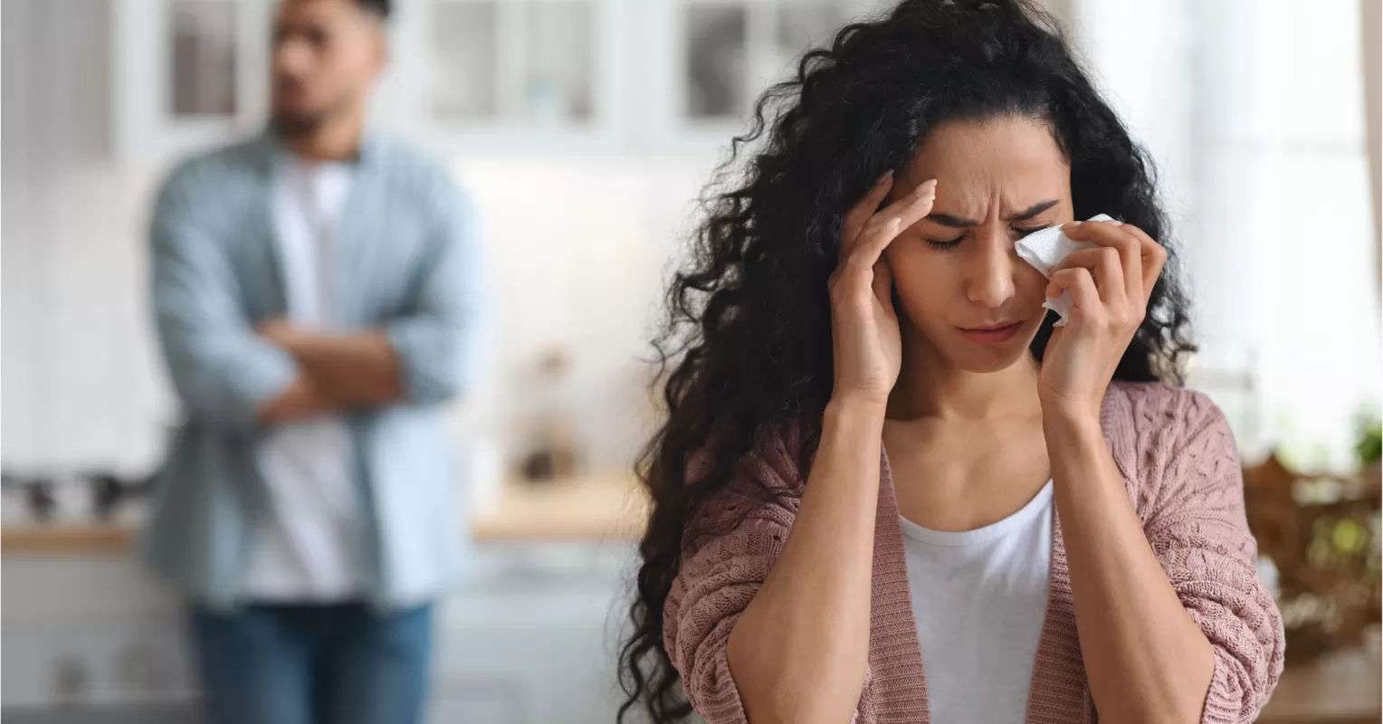 Person hesitating to leave a relationship, reflecting fear and uncertainty about their emotions