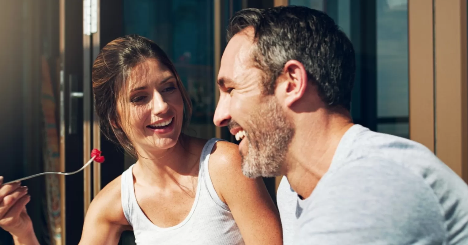 Couple appearing distant after a close moment, reflecting on emotional withdrawal signs in their relationship