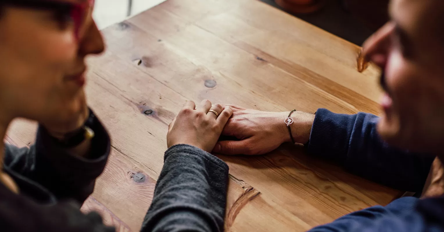 Couple engaged in a year-end relationship check-in, discussing emotions and future plans