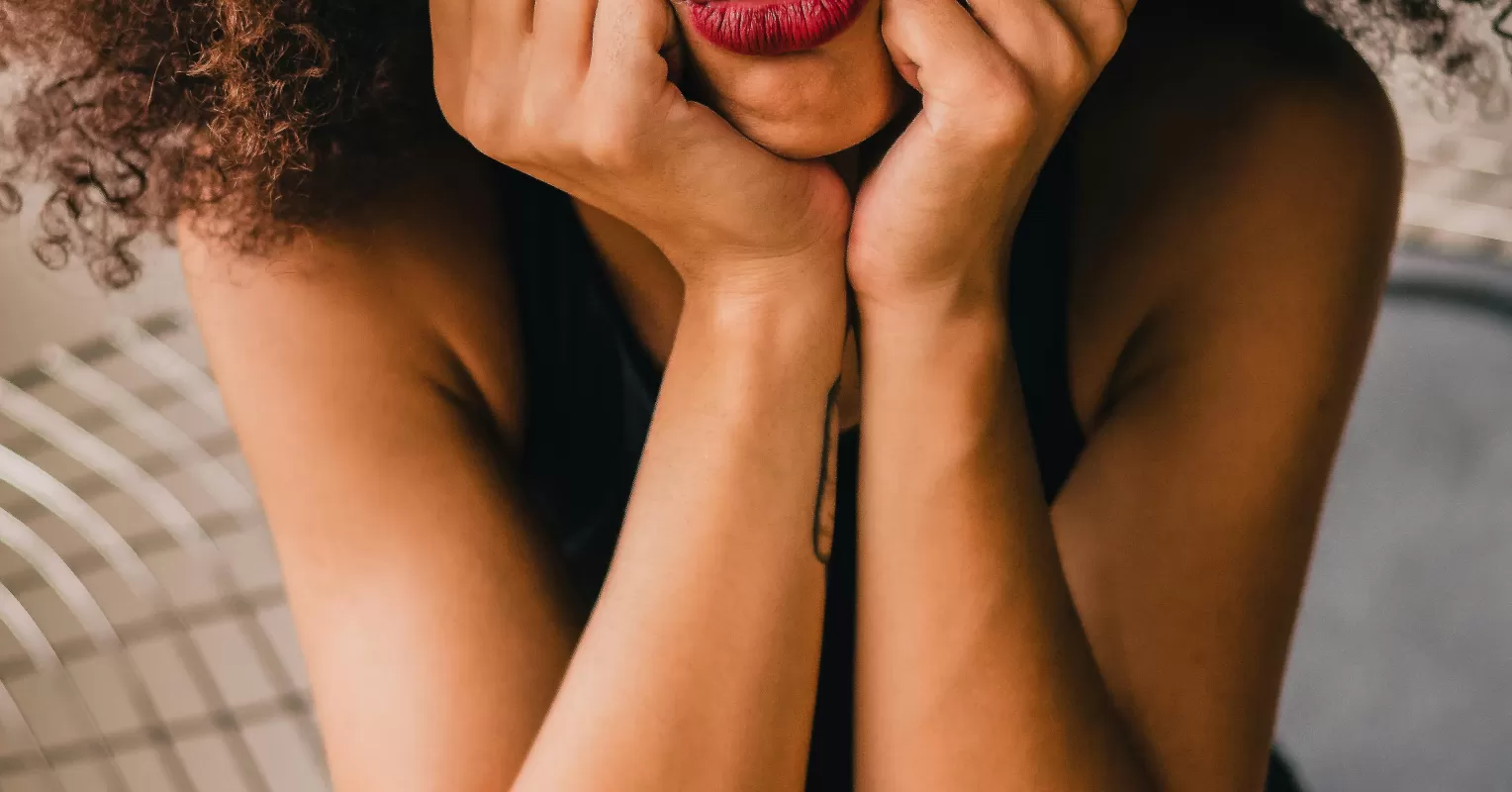 Individual reflecting on personal happiness amidst the joy of others in relationships