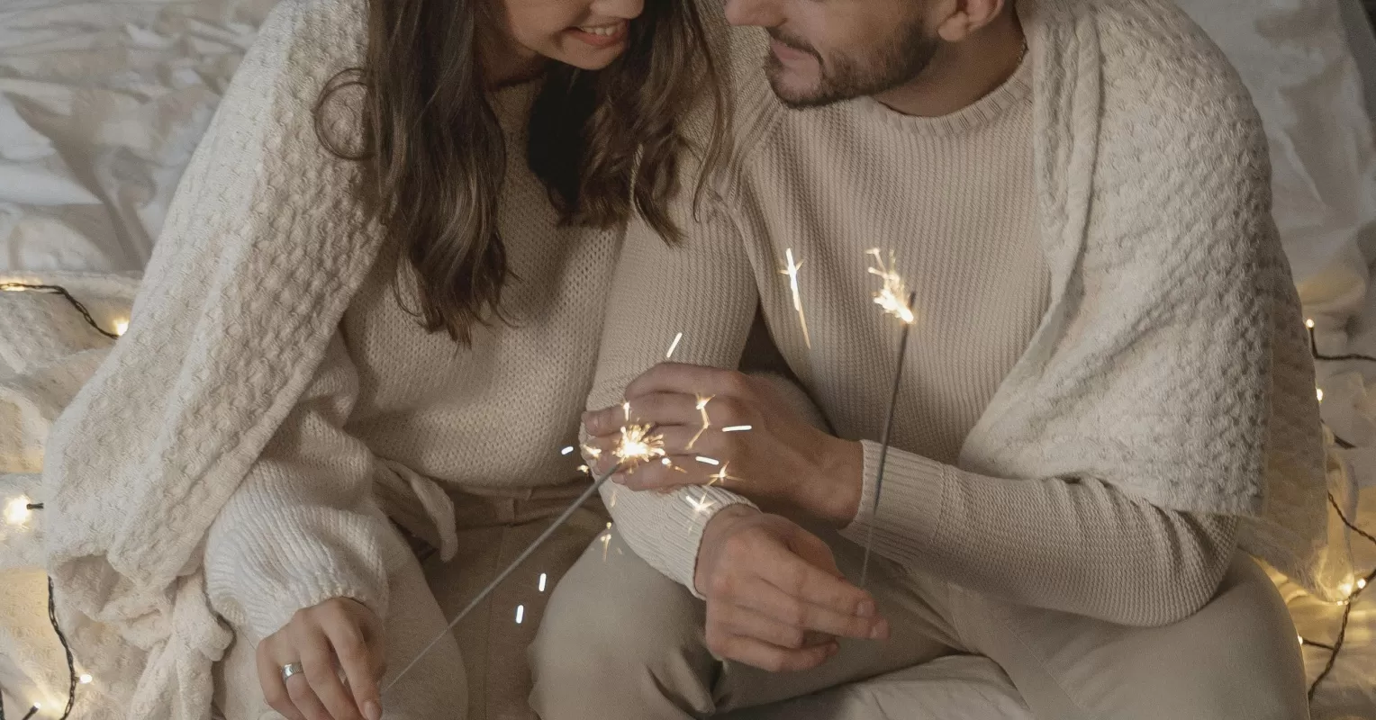 Couple sitting together, one partner looking withdrawn, avoiding deep conversations