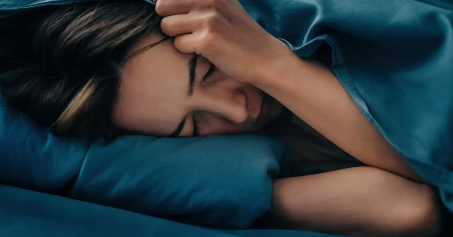 Person running from an unseen pursuer, reflecting anxiety in dreams about being chased