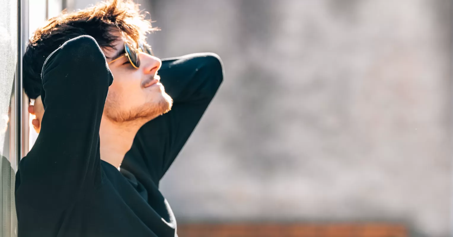 Individual contemplating the essence of a positive mindset while journaling