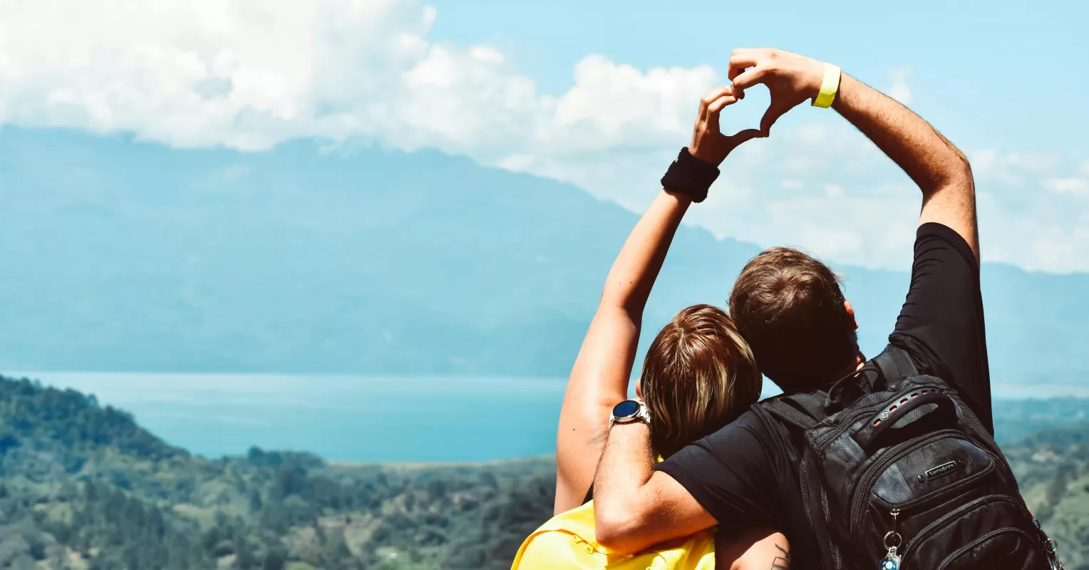 A couple joyfully embracing, illustrating the essence of unconditional love and relationship signals