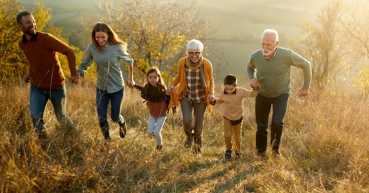 Grandparents feeling disconnected while observing grandchildren playing in the park