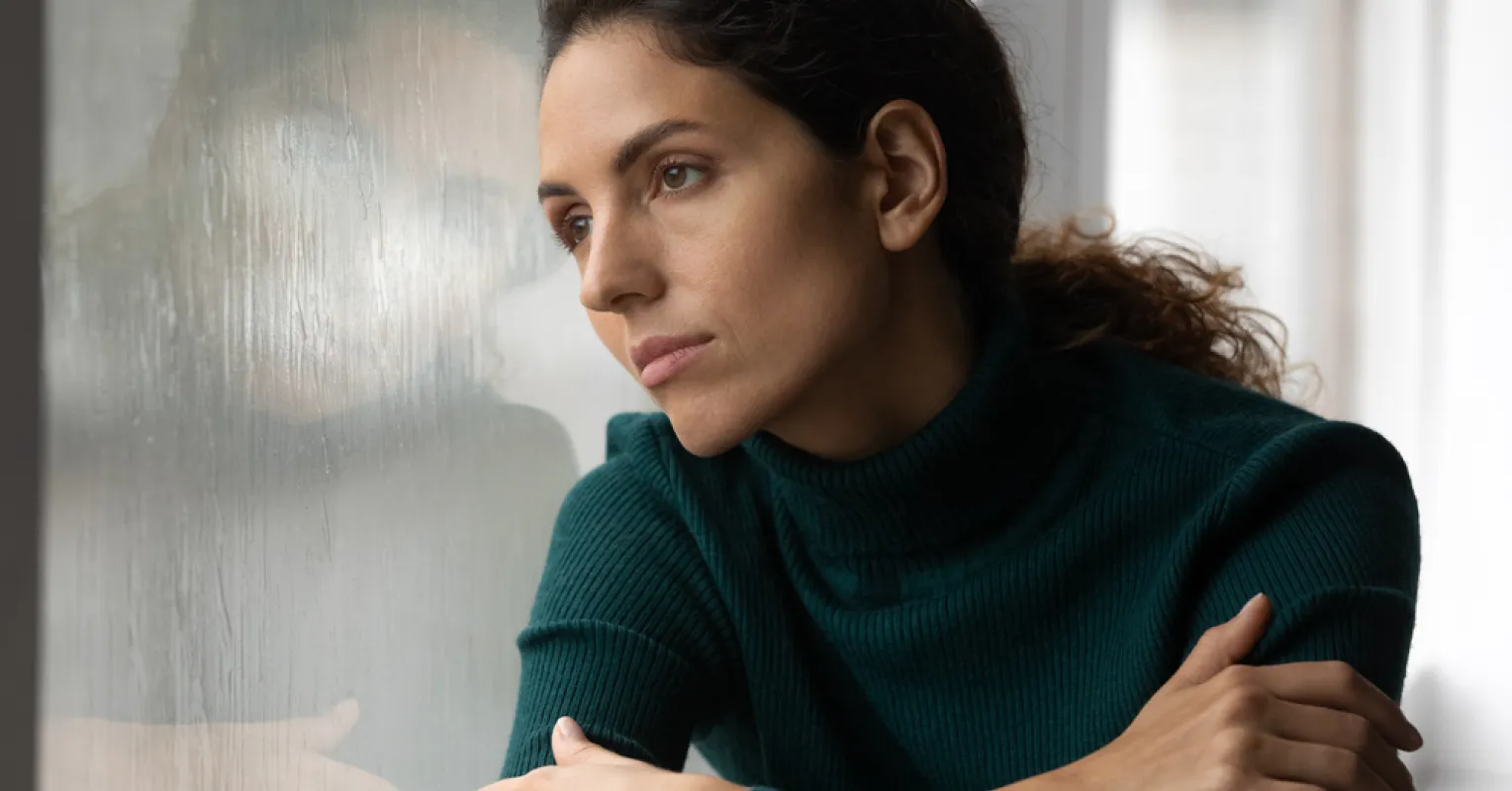 Person showing signs of self-absorption during a conversation with emotional disengagement