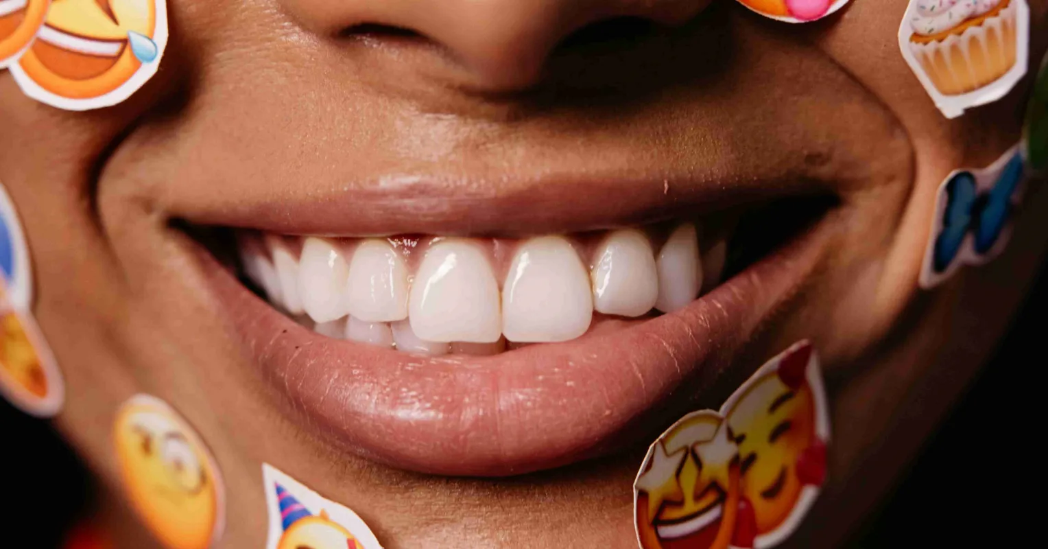 Person reacting to a text with laughter emojis during a serious conversation