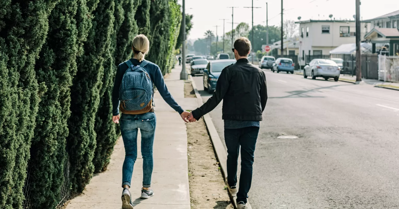 Couple sitting apart, feeling the emotional distance after personal changes.