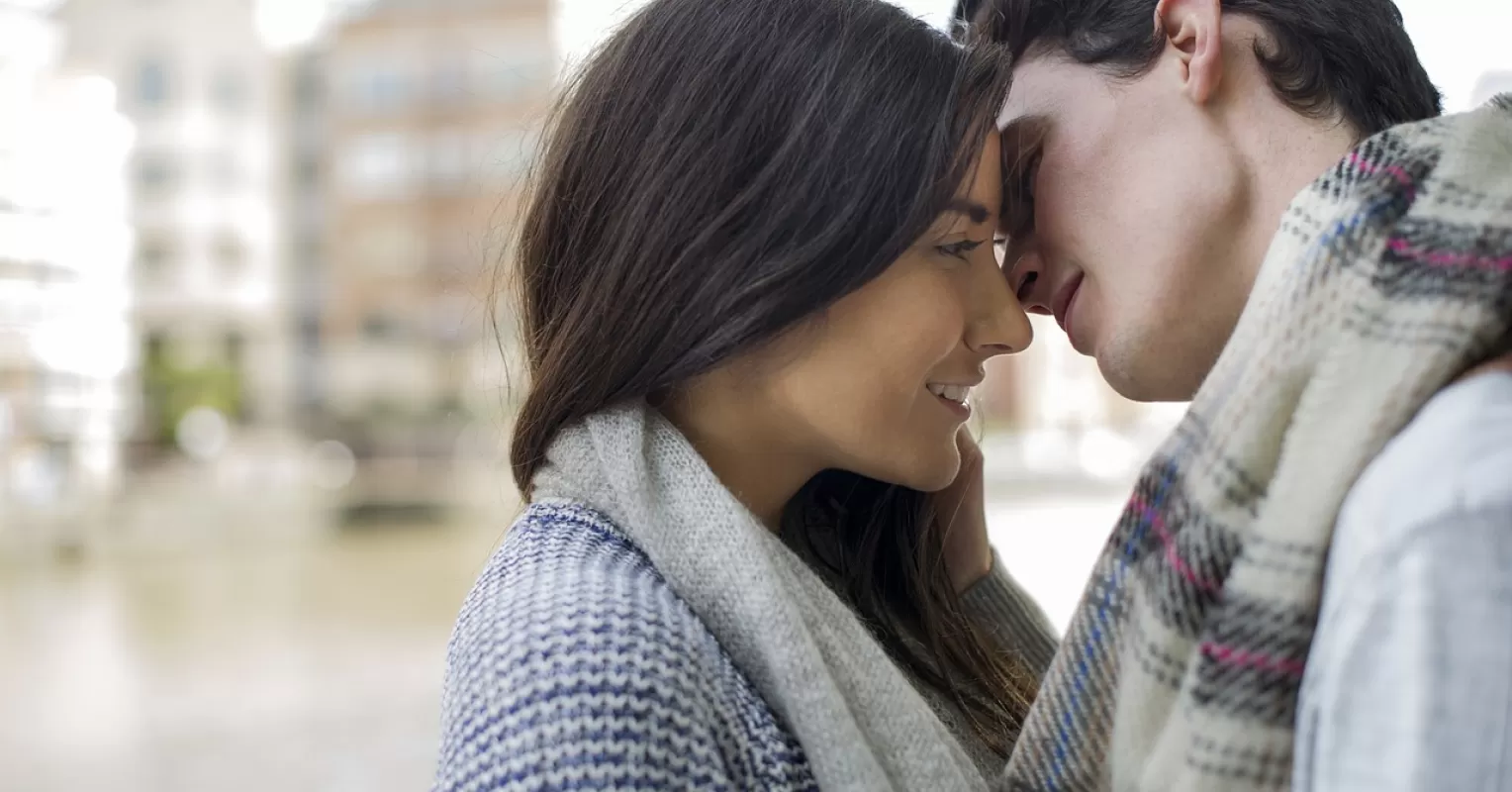 Couple sitting apart, reflecting on emotional intimacy and relationship signals