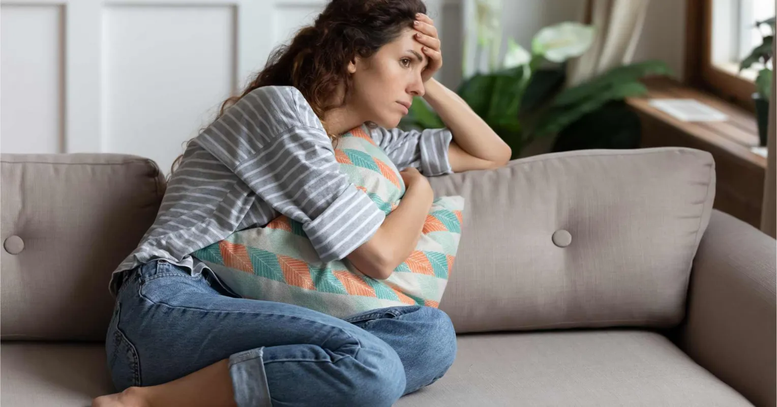 Couple sitting quietly, hinting at avoidance of serious relationship discussions