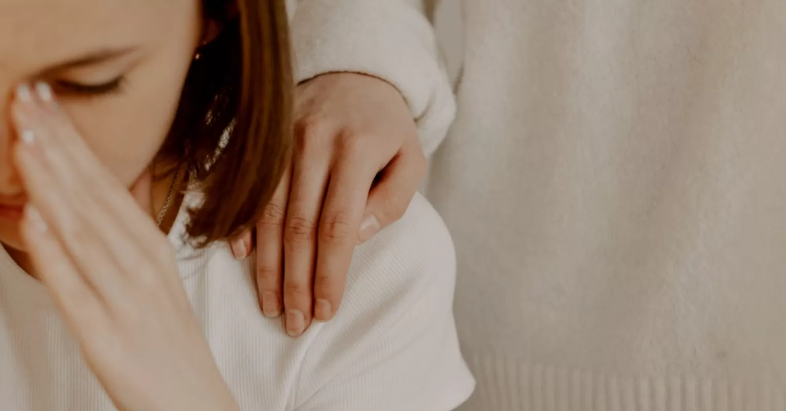Person reflecting on uncertainty in a relationship connected to what to do when my partner feels burdened by