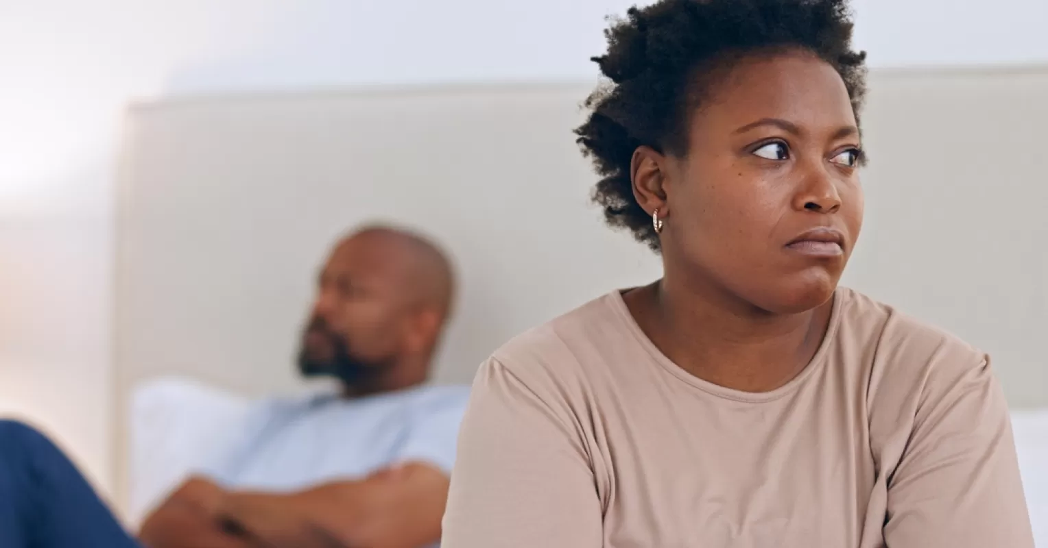 Person reflecting on uncertainty in a relationship connected to what to do when your partner feels different but