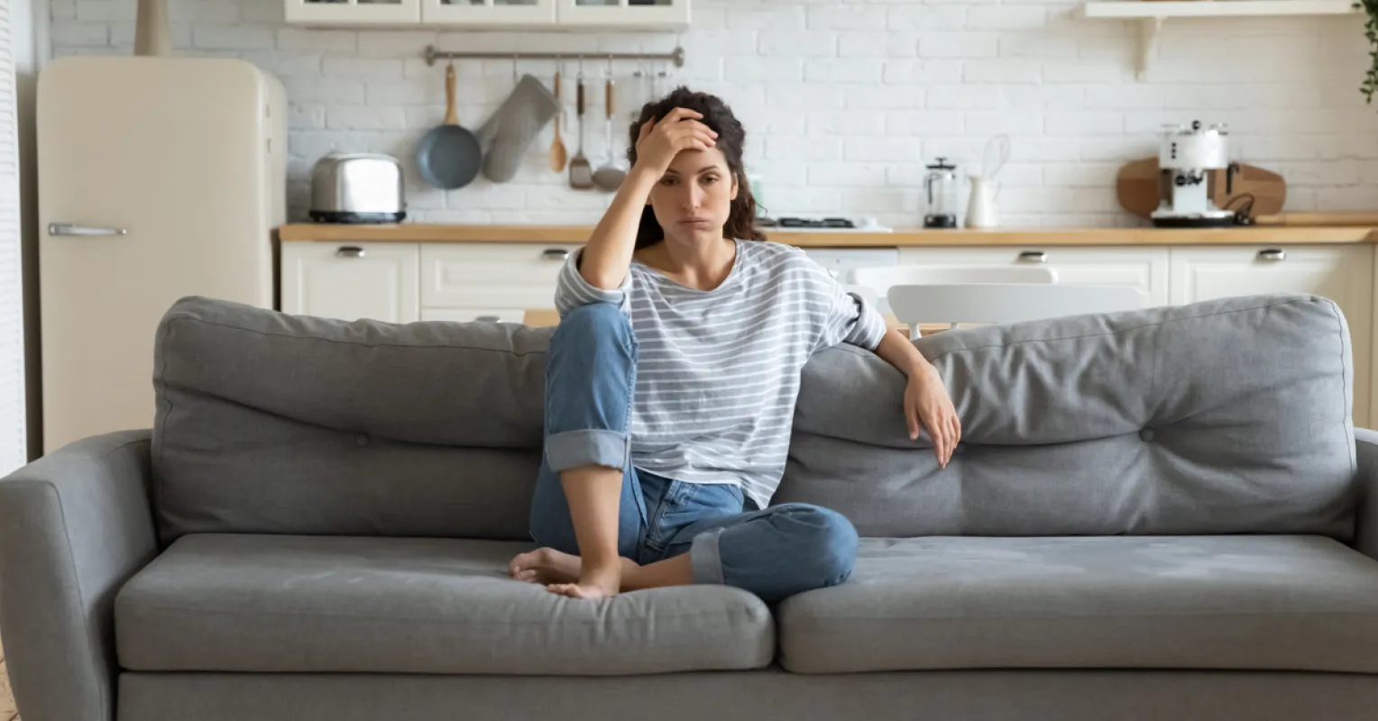 Person reflecting on uncertainty in a relationship connected to what to do when your partner feels distant but