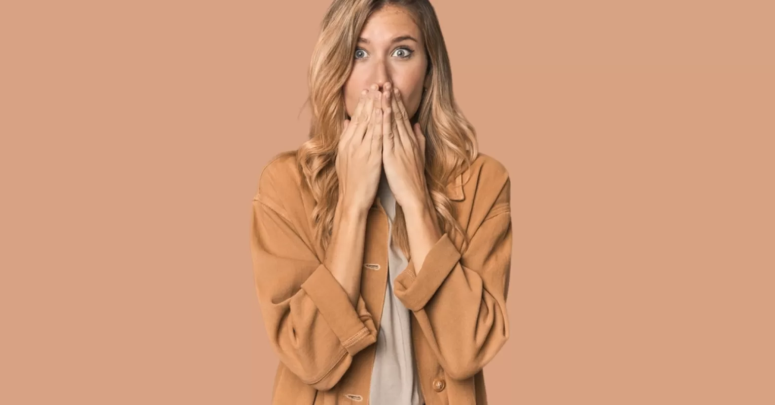 Person contemplating how to address a regrettable comment in a group chat