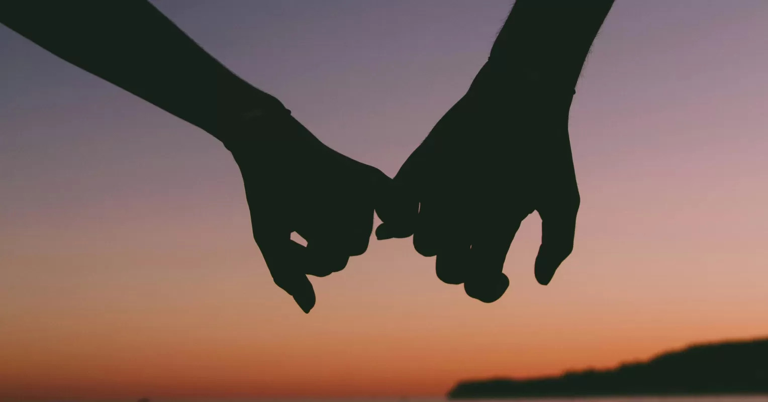Individual hesitating to trust a partner, reflecting on past trauma's impact on relationships