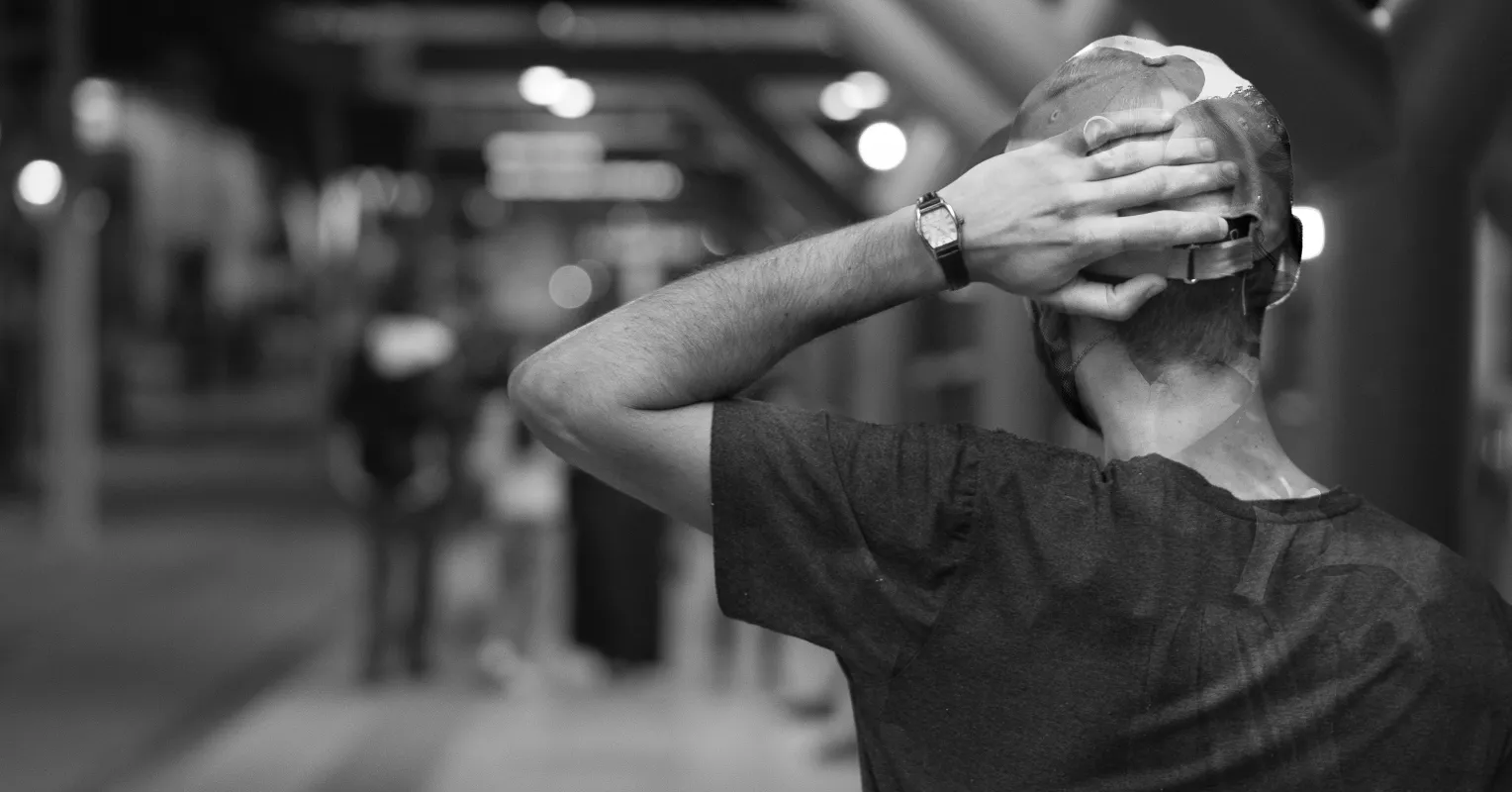 Individual contemplating feelings of self-blame after a partner's infidelity and emotional turmoil
