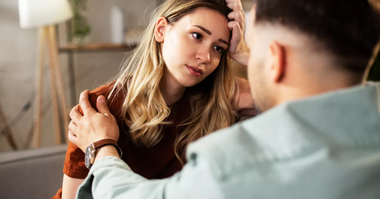 Person feeling conflicted about prioritizing personal needs in a relationship