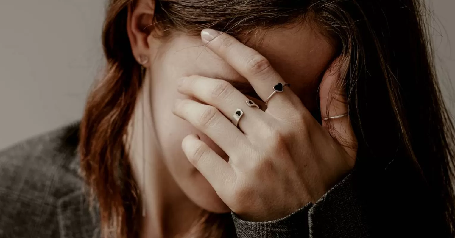 Individual feeling judged in a relationship, reflecting on scrutiny and emotional reactions.