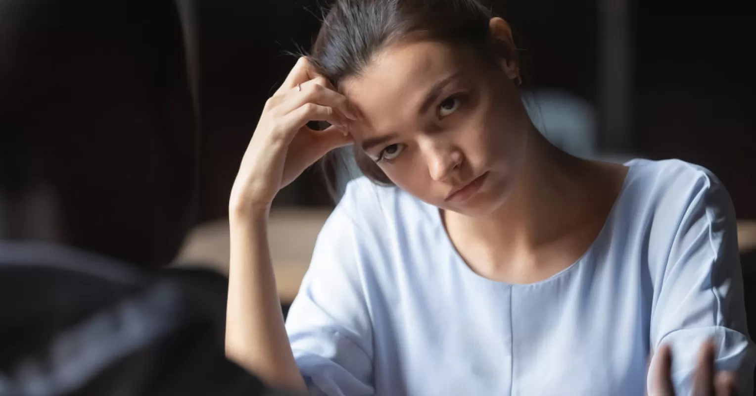 Individual contemplating overwhelming feelings related to relationship responsibilities and partner dynamics