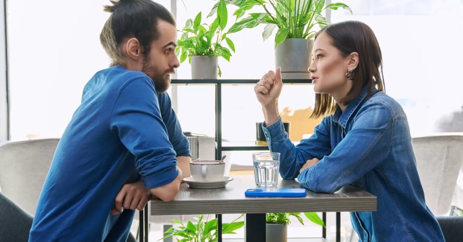 Individual feeling overwhelmed by societal expectations on personal storytelling during dates