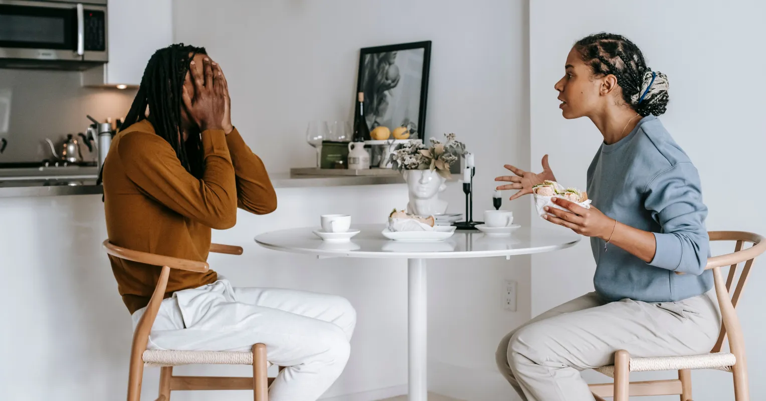 Individual hesitating to express vulnerability, fearing emotional exposure in a relationship
