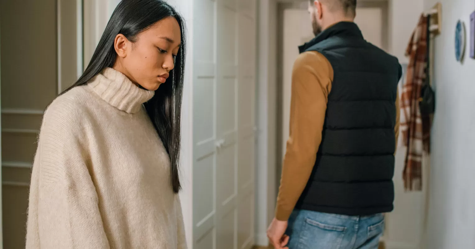Individual deep in thought, reflecting on doubts about their partner’s love and relationship signals