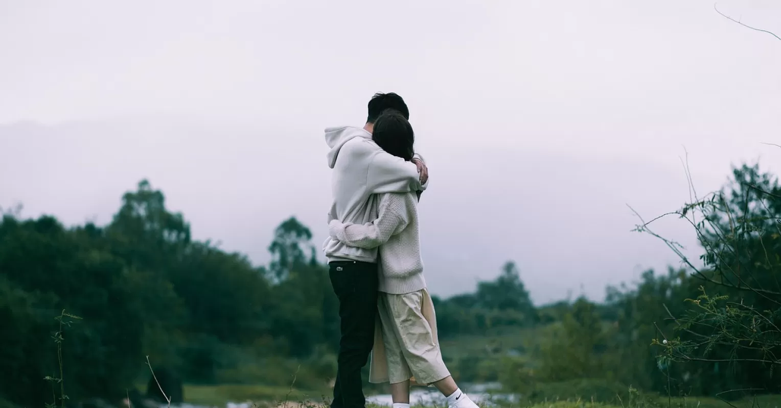 Individual contemplating relationship patterns and self-sabotage as intimacy increases.