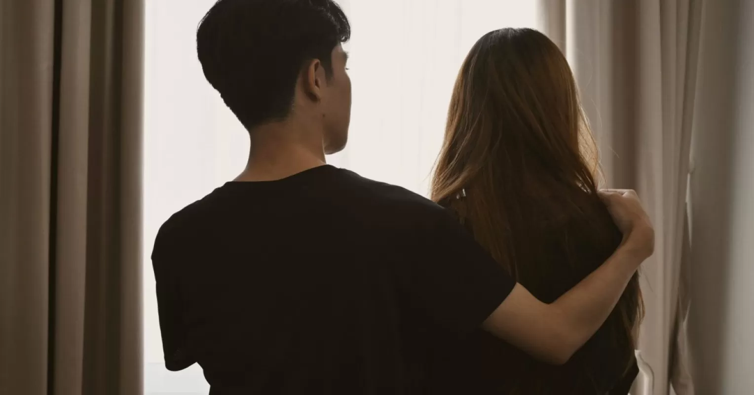 Person reflecting on uncertainty in a relationship connected to why does it feel like my partner takes me